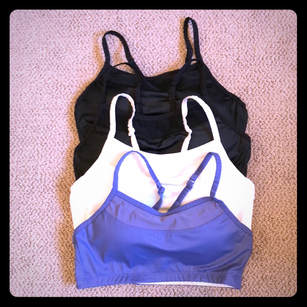 Four pack of Moving Comfort Sports Bras